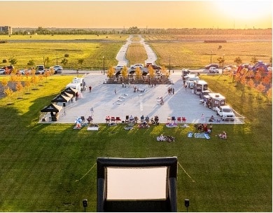 Aerial shot of free summer events in Omaha coordinated by Heartwood Preserve, including food trucks and outdoor movie