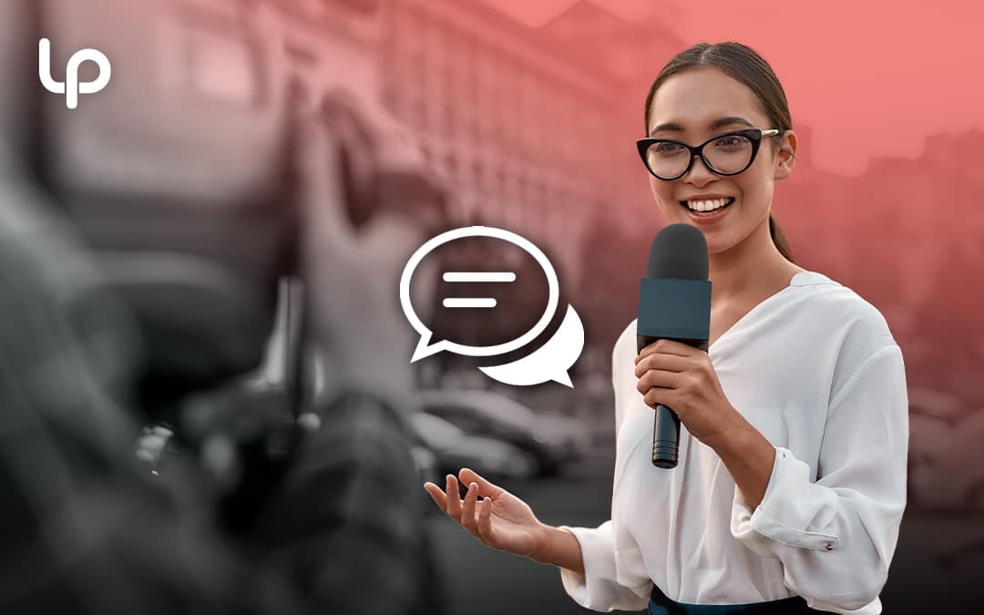 Woman in glasses standing in front of professional camera interviewing for media interview