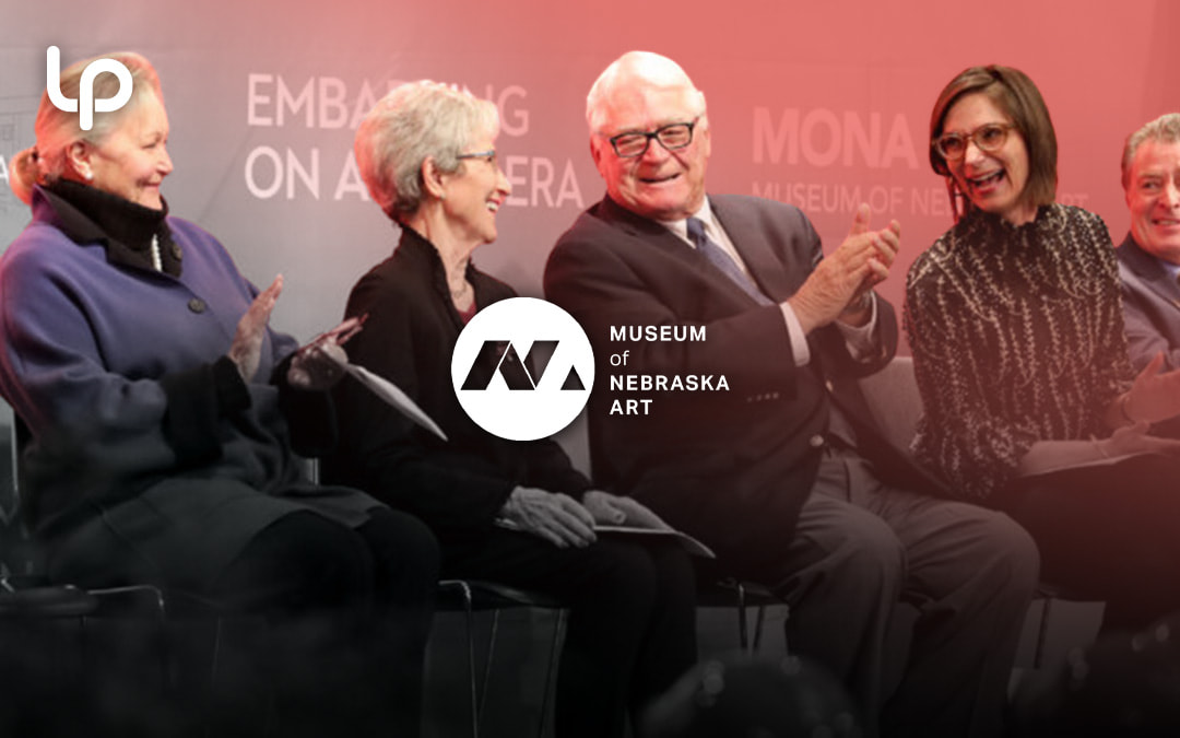 Panel discussion at a Museum of Nebraska Art event with speakers seated in front of an audience.